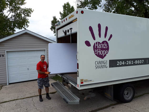 Hands of Hope truck and worker